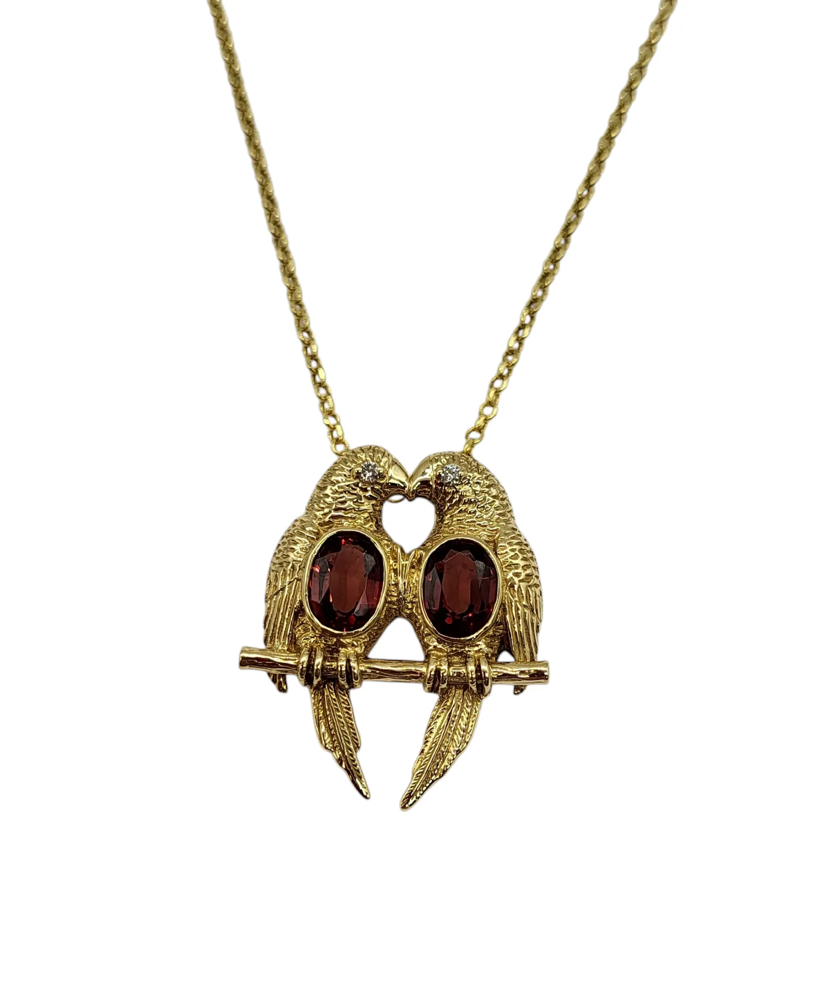 14 Karat Gold Parrot Pendant with Garnet Gemstones