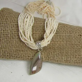 Cream  Multi-strand Necklace with  Petrified Wood Pendant