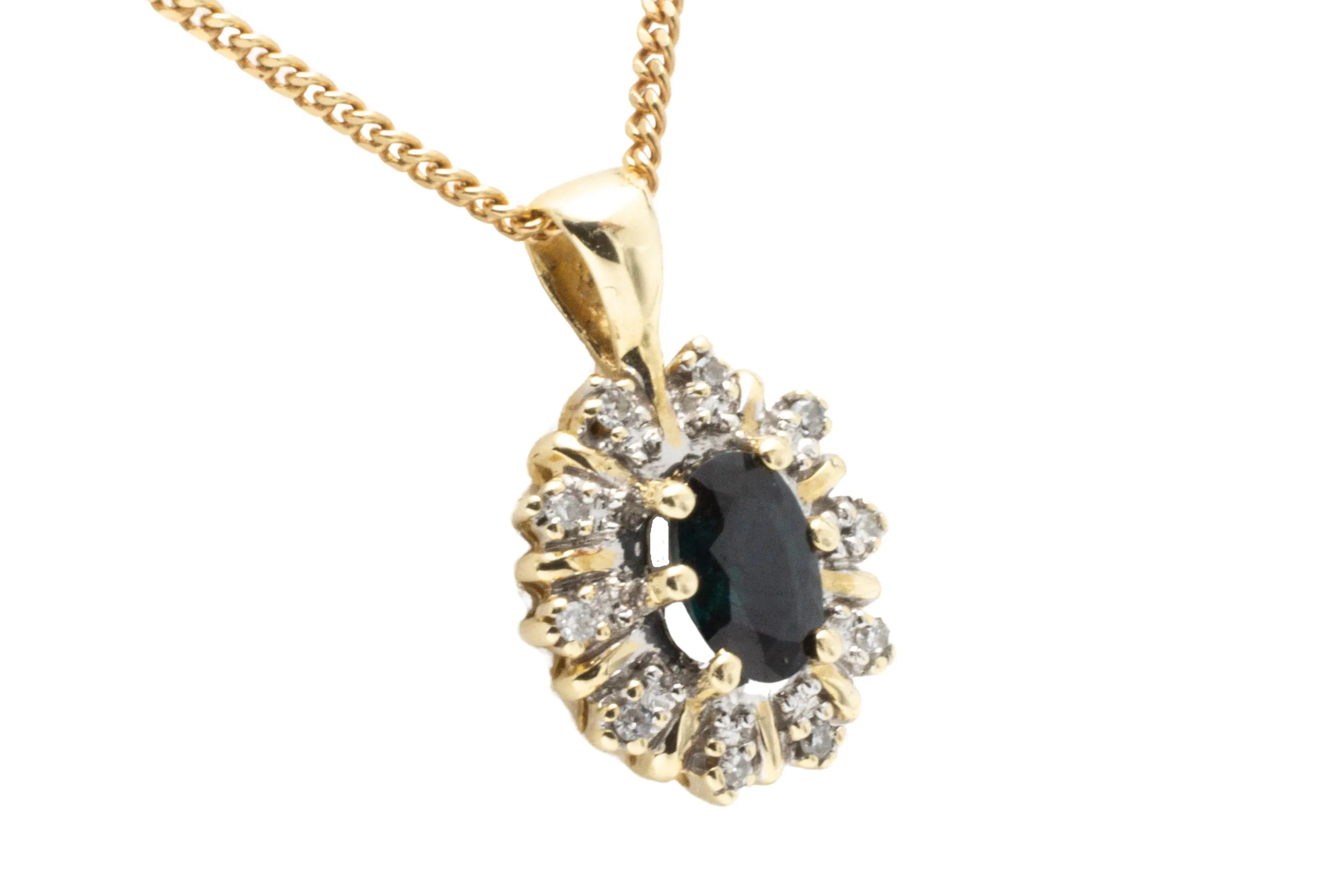 Sapphire and diamond pendant in 14 carat gold